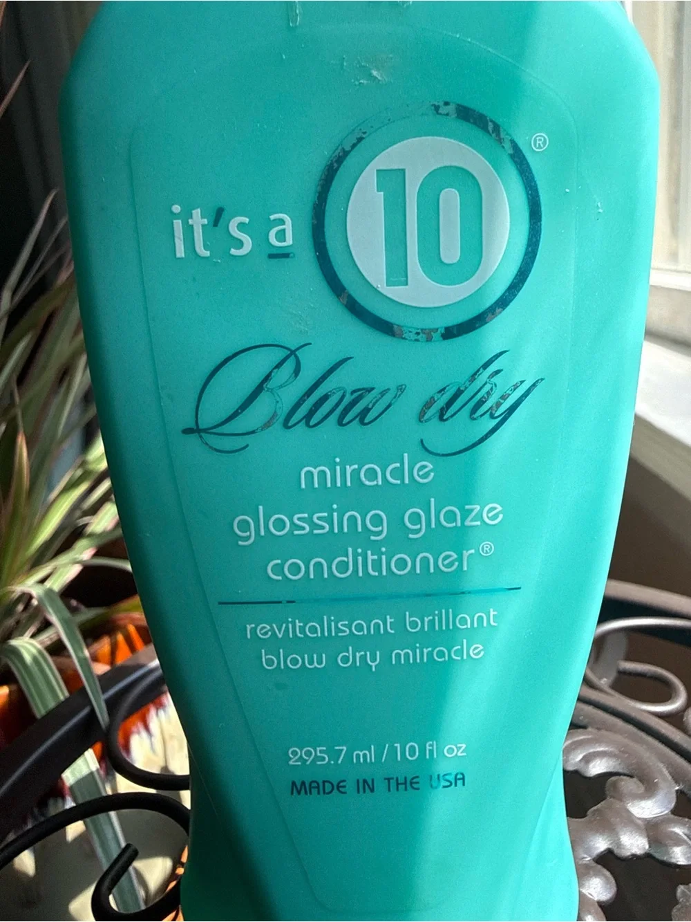 It's a 10 Miracle Glossing Glaze Conditioner — Teal Bottle